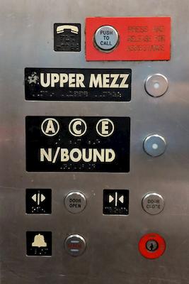 Elevator buttons are sometimes labeled with train services