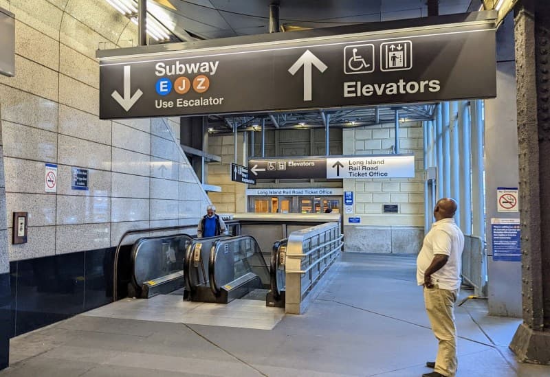 Signs to the E/J/Z subway at Jamaica station
