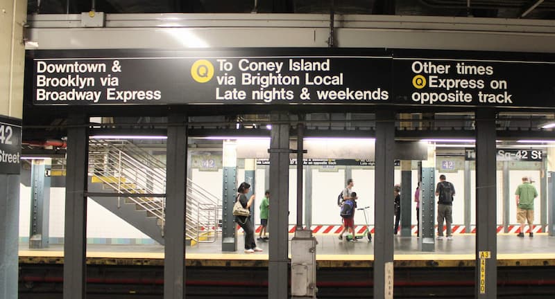 Overhead signs above the train track